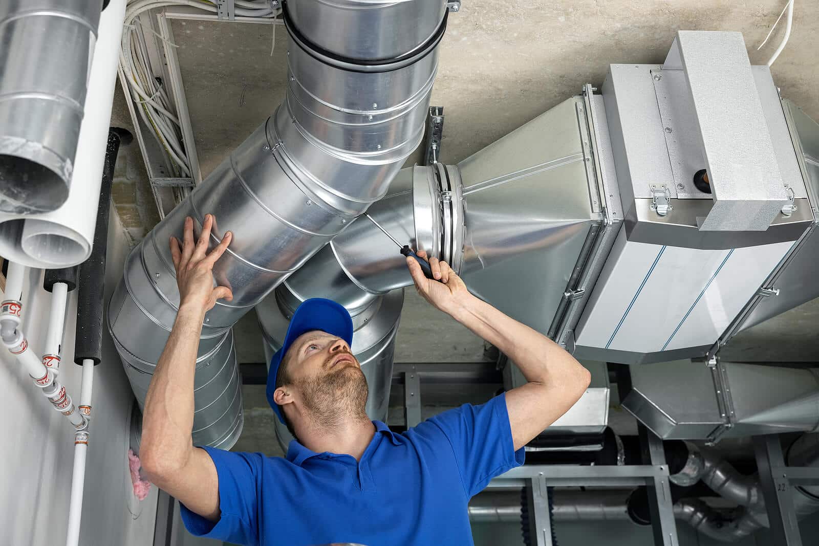 HVAC technician inspecting and repairing air ducts in Santa Clara