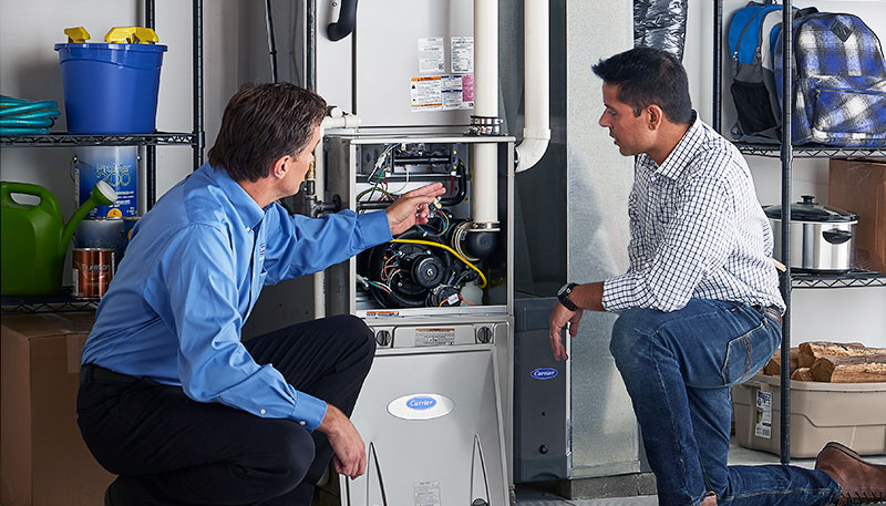 Technician evaluating a furnace for repair or replacement in Santa Clara