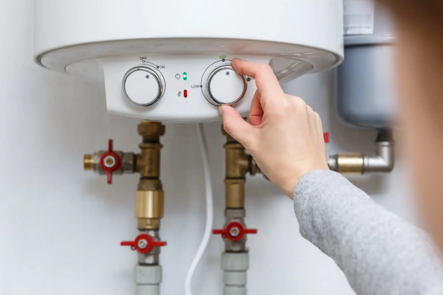 Technician adjusting a water heater in Santa Clara
